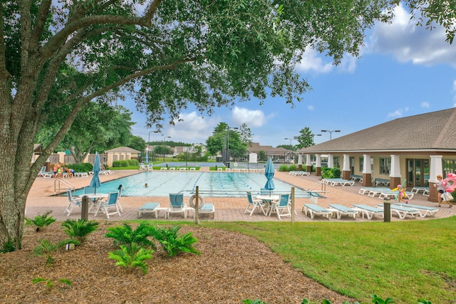 community pool with a patio area