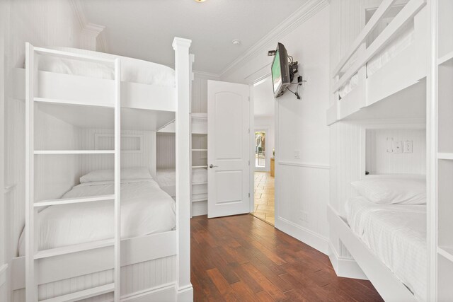4782 Ocean Blvd, Destin, FL 32541 - unfurnished bedroom featuring wood finished floors, crown molding, and ornate columns