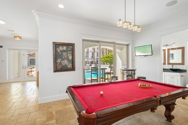 4782 Ocean Blvd, Destin, FL 32541 - playroom featuring ornamental molding, billiards, stone tile flooring, baseboards, and a sink