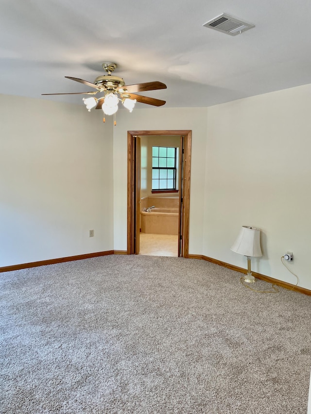 5882 Willow Ln, Crestview, FL 32539 - carpeted spare room with a ceiling fan and baseboards