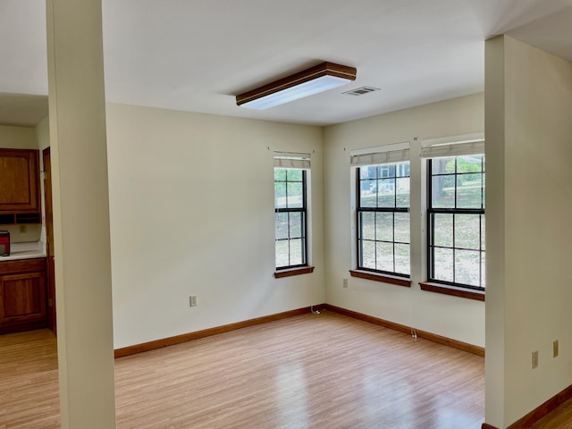 5882 Willow Ln, Crestview, FL 32539 - unfurnished room featuring plenty of natural light, light wood-style floors, and baseboards