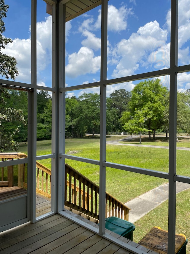 5882 Willow Ln, Crestview, FL 32539 - unfurnished sunroom with view of scattered trees
