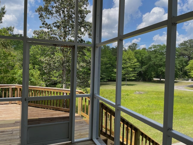 5882 Willow Ln, Crestview, FL 32539 - unfurnished sunroom with view of wooded area and healthy amount of natural light