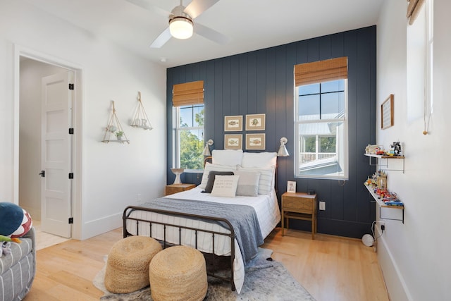 180 Bayou Edge Lndg, Santa Rosa Beach, FL 32459 - bedroom with wood finished floors, multiple windows, and baseboards