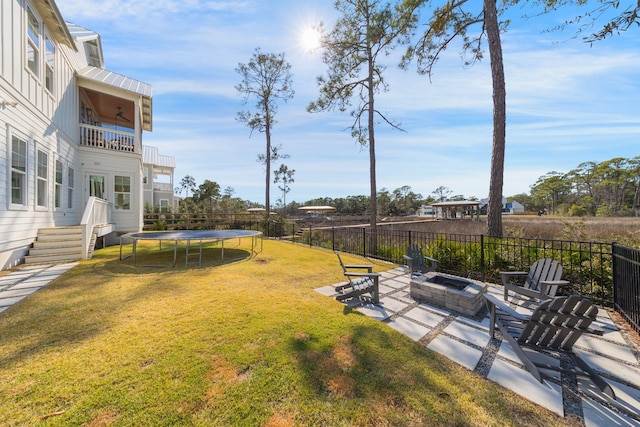 180 Bayou Edge Lndg, Santa Rosa Beach, FL 32459 - view of yard featuring a fire pit, a balcony, a trampoline, and a patio