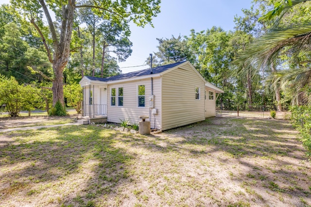 view of property exterior featuring fence