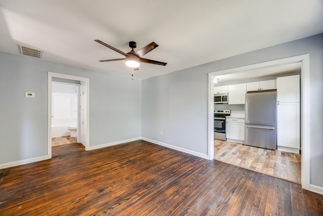 unfurnished living room with a ceiling fan, wood finished floors, and baseboards