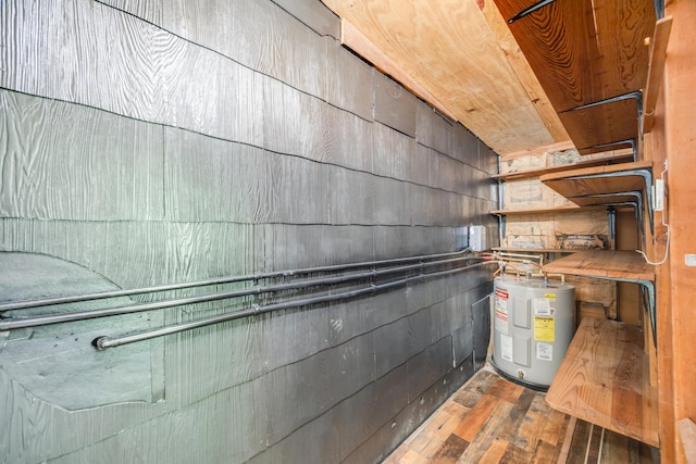 utility room featuring water heater