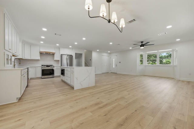 20 NW Higdon Ct, Fort Walton Beach, FL 32547 - kitchen featuring appliances with stainless steel finishes, recessed lighting, ceiling fan, a sink, and a kitchen island