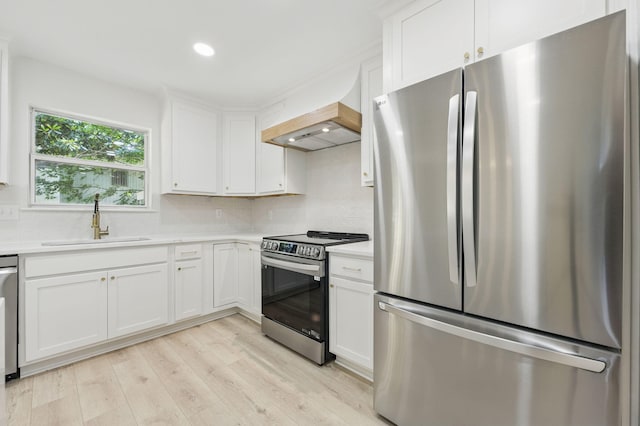 20 NW Higdon Ct, Fort Walton Beach, FL 32547 - kitchen featuring appliances with stainless steel finishes, a sink, premium range hood, light countertops, and recessed lighting