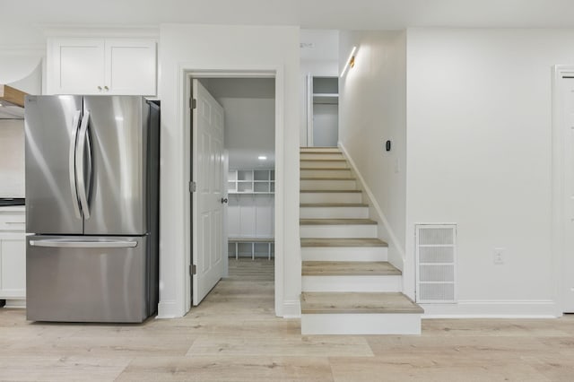 20 NW Higdon Ct, Fort Walton Beach, FL 32547 - staircase with wood finished floors and baseboards