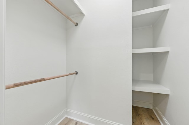20 NW Higdon Ct, Fort Walton Beach, FL 32547 - spacious closet featuring wood finished floors