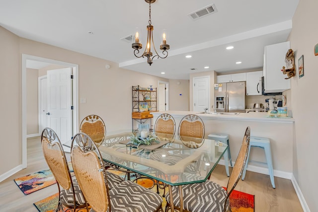 2076 Scenic Gulf Dr Unit 4011, Miramar Beach, FL 32550 - dining room with light wood-style floors, recessed lighting, baseboards, and a chandelier