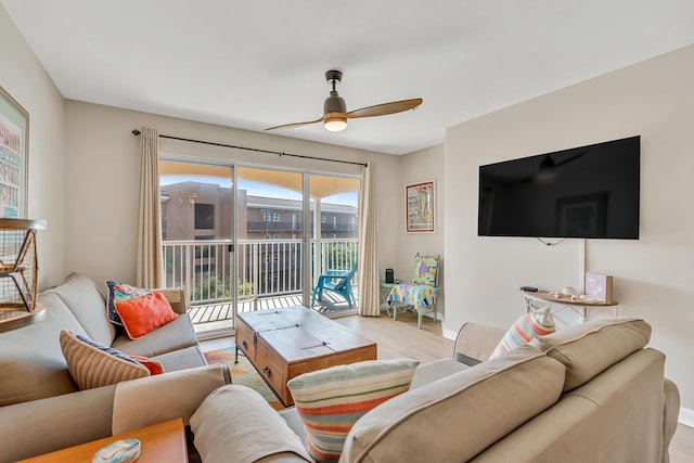 2076 Scenic Gulf Dr Unit 4011, Miramar Beach, FL 32550 - living area with a ceiling fan, light wood-style floors, and baseboards