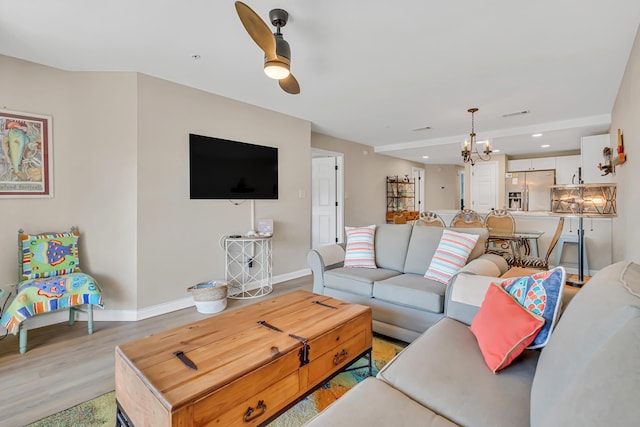 2076 Scenic Gulf Dr Unit 4011, Miramar Beach, FL 32550 - living area with baseboards, a chandelier, light wood-style flooring, a ceiling fan, and recessed lighting