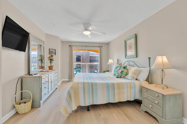 2076 Scenic Gulf Dr Unit 4011, Miramar Beach, FL 32550 - bedroom with access to exterior, light wood finished floors, multiple windows, and baseboards