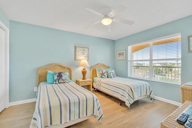 2076 Scenic Gulf Dr Unit 4011, Miramar Beach, FL 32550 - bedroom featuring baseboards, wood finished floors, and a ceiling fan