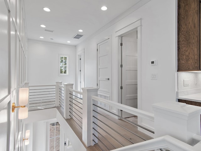173 Crissman Rd, Santa Rosa Beach, FL 32459 - hall with an upstairs landing, crown molding, and recessed lighting
