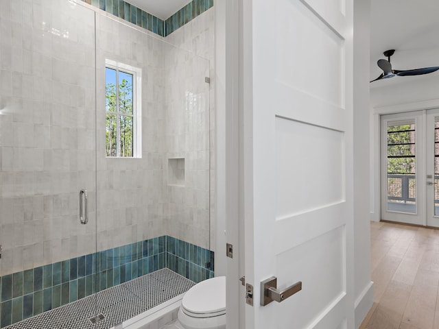 173 Crissman Rd, Santa Rosa Beach, FL 32459 - bathroom featuring ceiling fan, toilet, a stall shower, and wood finished floors
