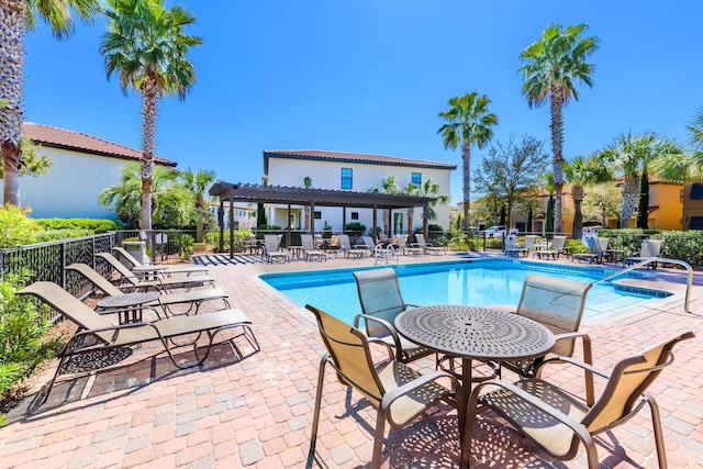 1843 Boardwalk Dr, Sandestin, FL 32550 - community pool with fence, a patio area, and a pergola