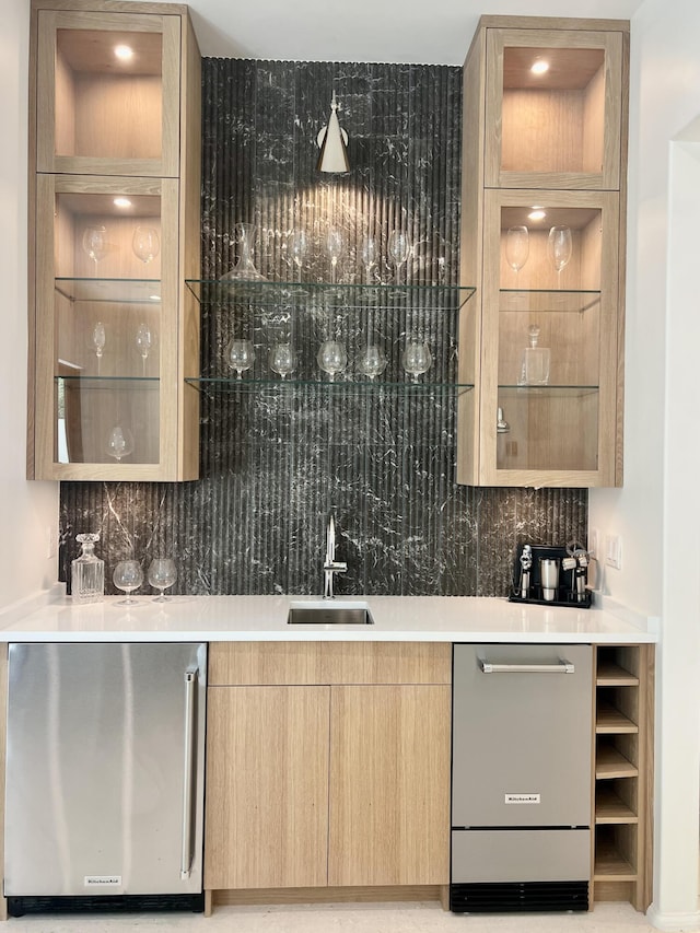 238 Sand Oaks Cir, Santa Rosa Beach, FL 32459 - indoor wet bar featuring stainless steel dishwasher, fridge, and decorative backsplash
