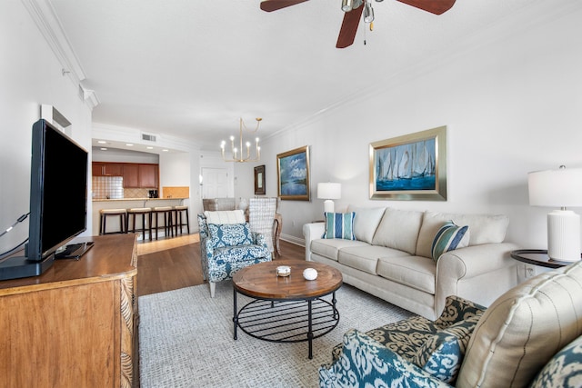 10 Harbor Blvd Unit E409, Destin, FL 32541 - living room with crown molding, light wood-style floors, a ceiling fan, a chandelier, and recessed lighting