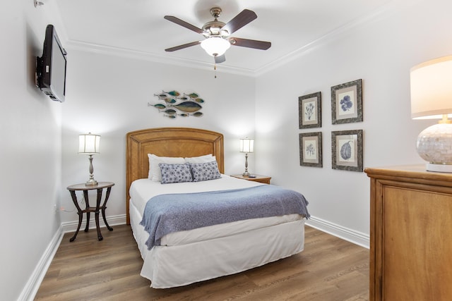10 Harbor Blvd Unit E409, Destin, FL 32541 - bedroom featuring crown molding, wood finished floors, baseboards, and a ceiling fan