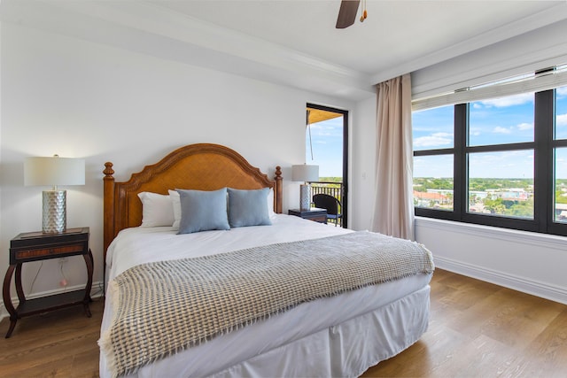 10 Harbor Blvd Unit E409, Destin, FL 32541 - bedroom featuring wood finished floors, baseboards, ornamental molding, and a ceiling fan