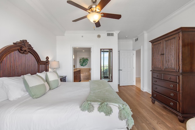 10 Harbor Blvd Unit E409, Destin, FL 32541 - bedroom with ornamental molding, wood finished floors, ensuite bath, baseboards, and ceiling fan