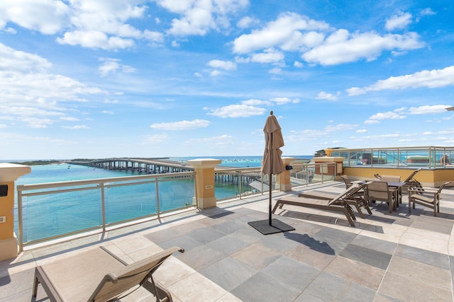 10 Harbor Blvd Unit E409, Destin, FL 32541 - view of patio featuring a water view and a balcony