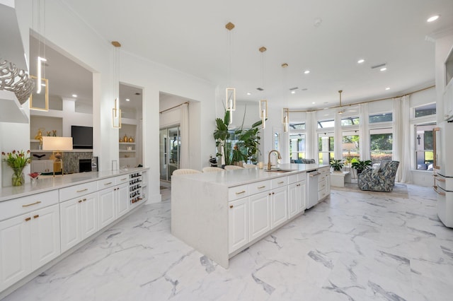 6290 Augusta Cv, Destin, FL 32541 - kitchen with a sink, dishwasher, white cabinets, light marble finish floors, and recessed lighting