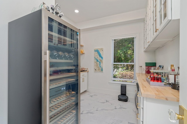 6290 Augusta Cv, Destin, FL 32541 - bar featuring light marble finish flooring, baseboards, and recessed lighting