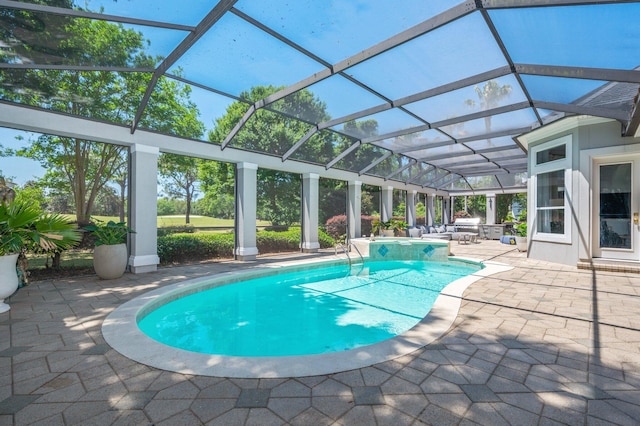 6290 Augusta Cv, Destin, FL 32541 - swimming pool with a patio, a jacuzzi, and glass enclosure