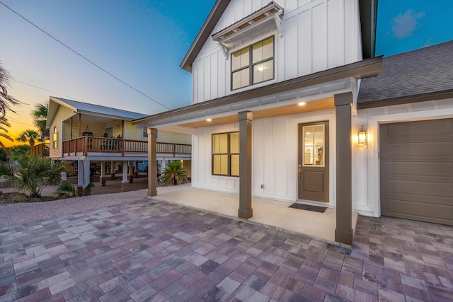 6424 Sunset Ave, Panama City Beach, FL 32408 - view of front of house with board and batten siding and a shingled roof