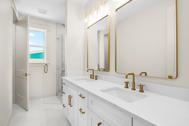 6424 Sunset Ave, Panama City Beach, FL 32408 - bathroom featuring a marble finish shower, marble finish flooring, double vanity, and baseboards