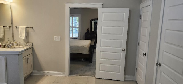 3100 Oriole Dr, Gulf Breeze, FL 32563 - bathroom with baseboards, tile patterned floors, and vanity