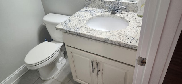3100 Oriole Dr, Gulf Breeze, FL 32563 - half bathroom with vanity, toilet, tile patterned flooring, and baseboards