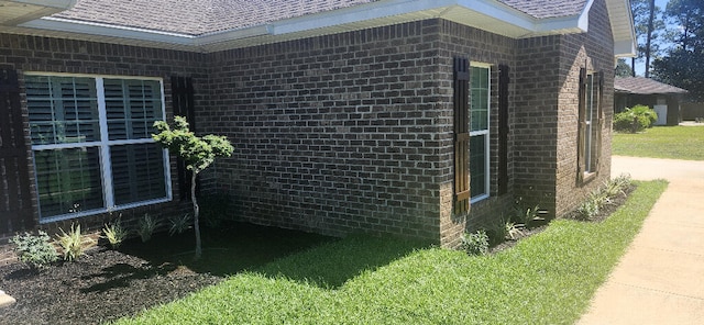 3100 Oriole Dr, Gulf Breeze, FL 32563 - view of property exterior featuring a shingled roof and brick siding