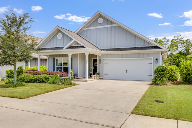 view of front facade with board and batten siding, roof with shingles, a front lawn, and a garage