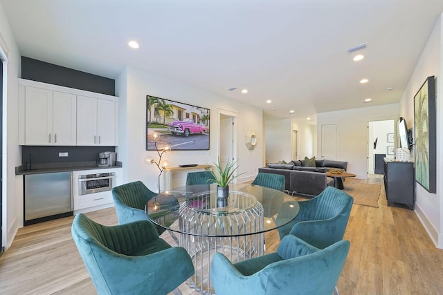 336 S Holiday Rd, Destin, FL 32550 - dining area with light wood-style floors, recessed lighting, and bar area