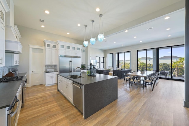 336 S Holiday Rd, Destin, FL 32550 - kitchen featuring dark countertops, stainless steel appliances, backsplash, plenty of natural light, and recessed lighting