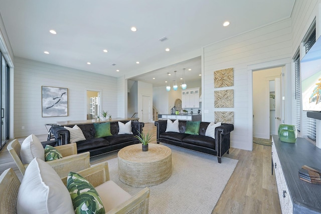 336 S Holiday Rd, Destin, FL 32550 - living area featuring light wood-style flooring, recessed lighting, and wood walls