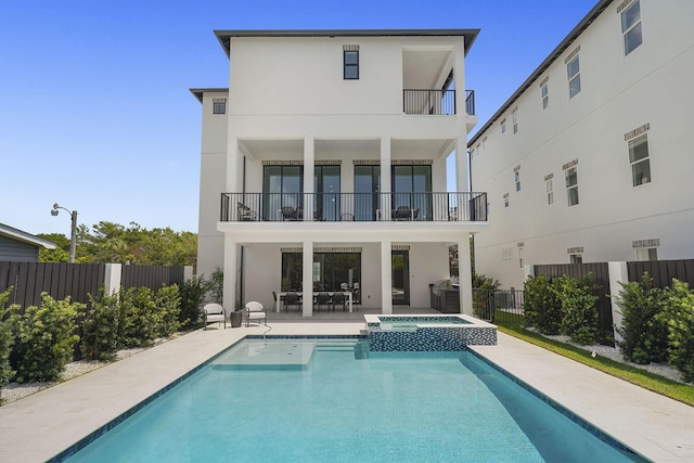 336 S Holiday Rd, Destin, FL 32550 - back of house featuring a balcony, a fenced backyard, and stucco siding