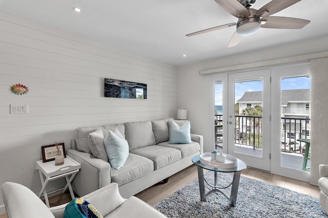 2384 Scenic Gulf Dr Unit C308, Miramar Beach, FL 32550 - living room featuring wooden walls, light wood-style floors, ceiling fan, and recessed lighting