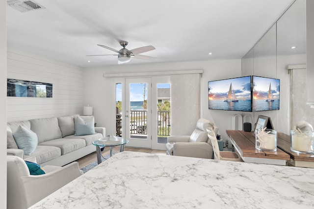 2384 Scenic Gulf Dr Unit C308, Miramar Beach, FL 32550 - living area featuring wood finished floors, recessed lighting, ceiling fan, and wooden walls