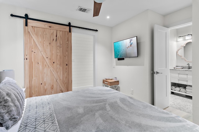 2384 Scenic Gulf Dr Unit C308, Miramar Beach, FL 32550 - bedroom featuring a barn door, recessed lighting, ceiling fan, and a sink