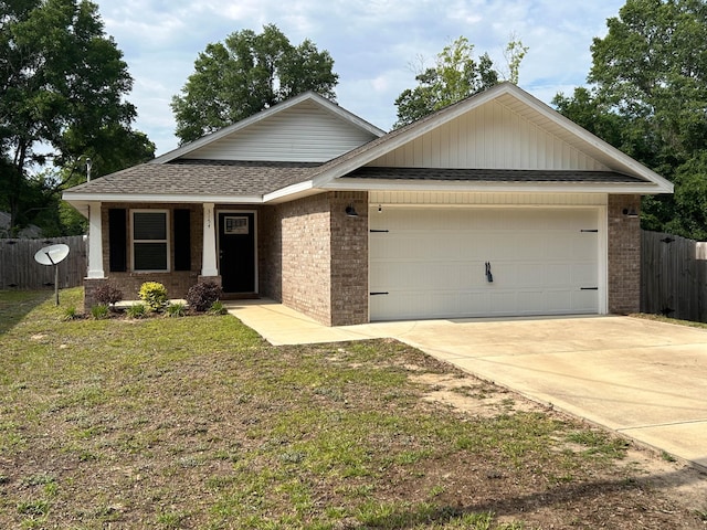 3154 Maple St, Crestview, FL 32539 - view of front of home with brick siding, a garage, a shingled roof, and driveway