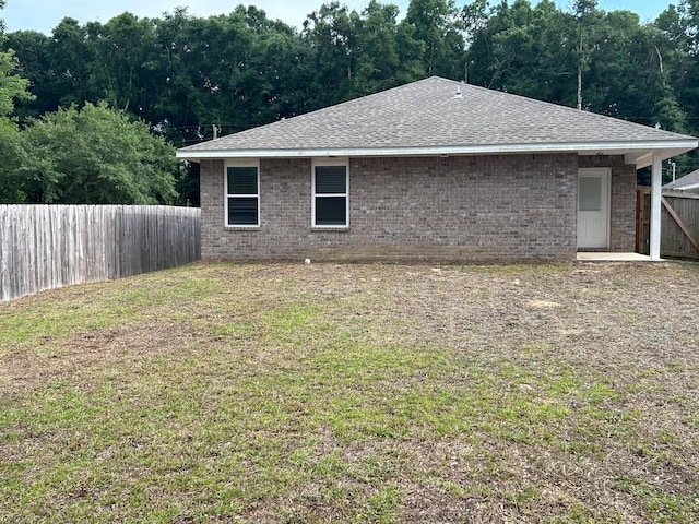 3154 Maple St, Crestview, FL 32539 - view of home's exterior with roof with shingles and brick siding