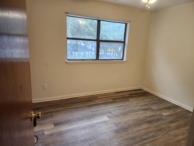 696 Tyner St Unit 7, Fort Walton Beach, FL 32547 - unfurnished room with healthy amount of natural light and dark wood finished floors