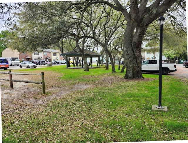 696 Tyner St Unit 7, Fort Walton Beach, FL 32547 - view of green lawn featuring a gazebo and a residential view